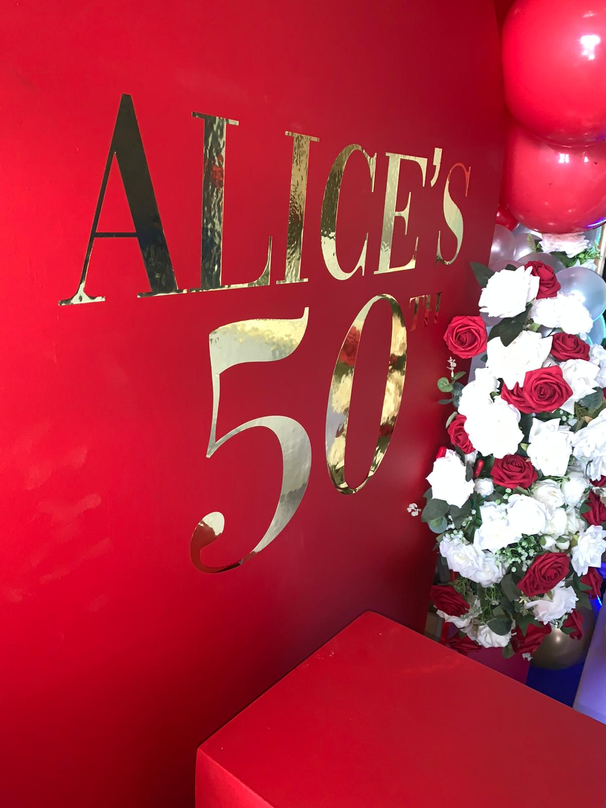 Alice's 50th red & gold balloon arch