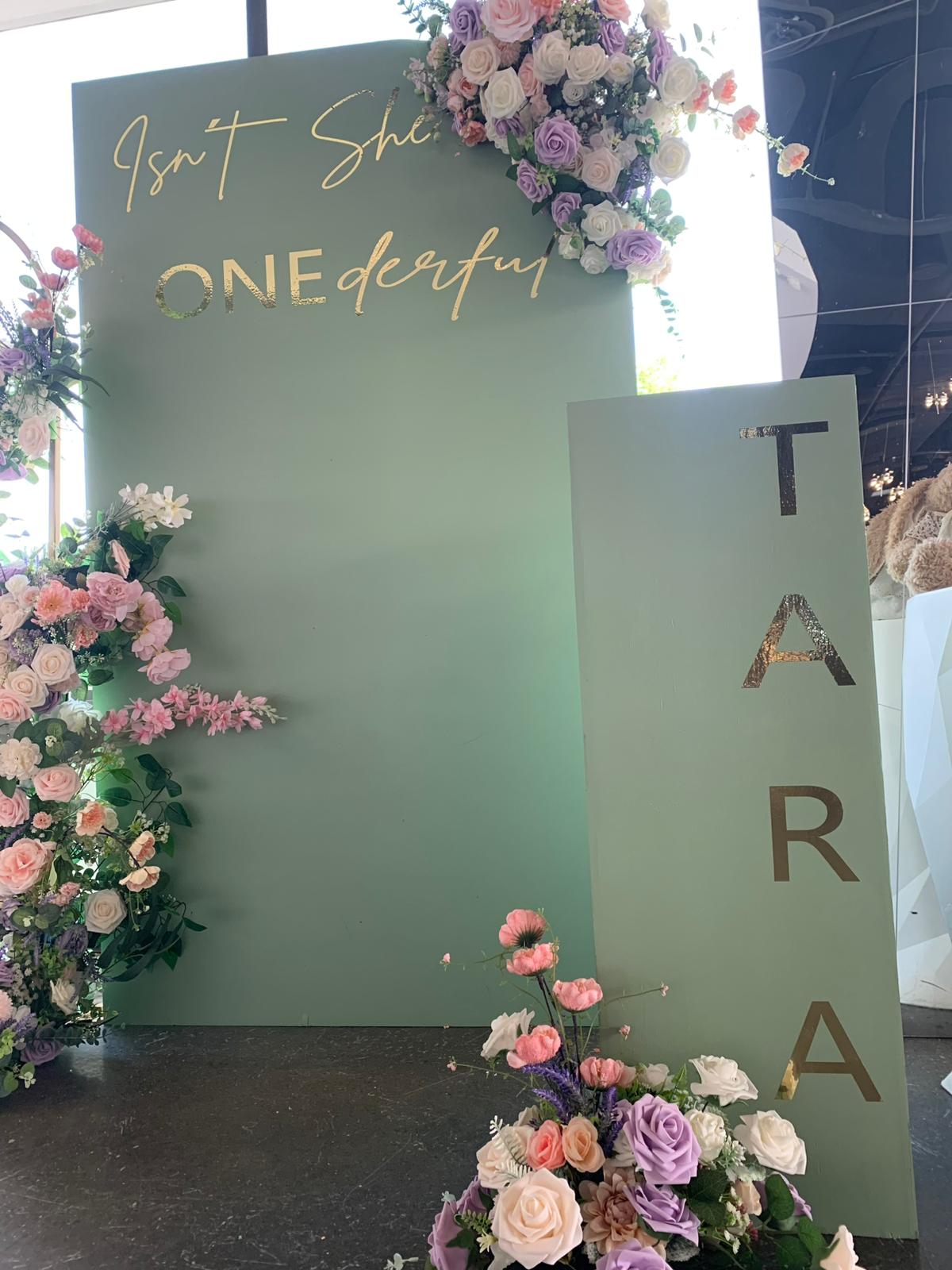 Floral arch with sage backdrop